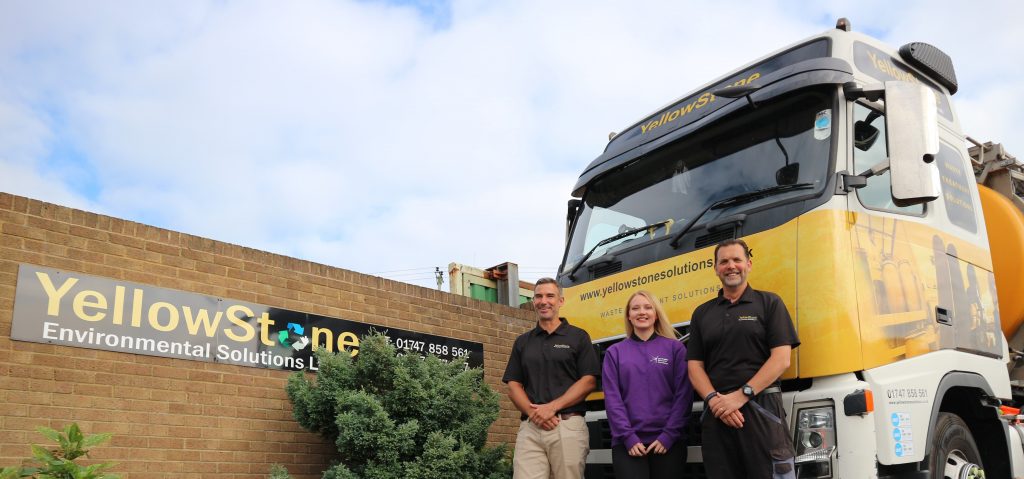 employees stood at the front of the truck