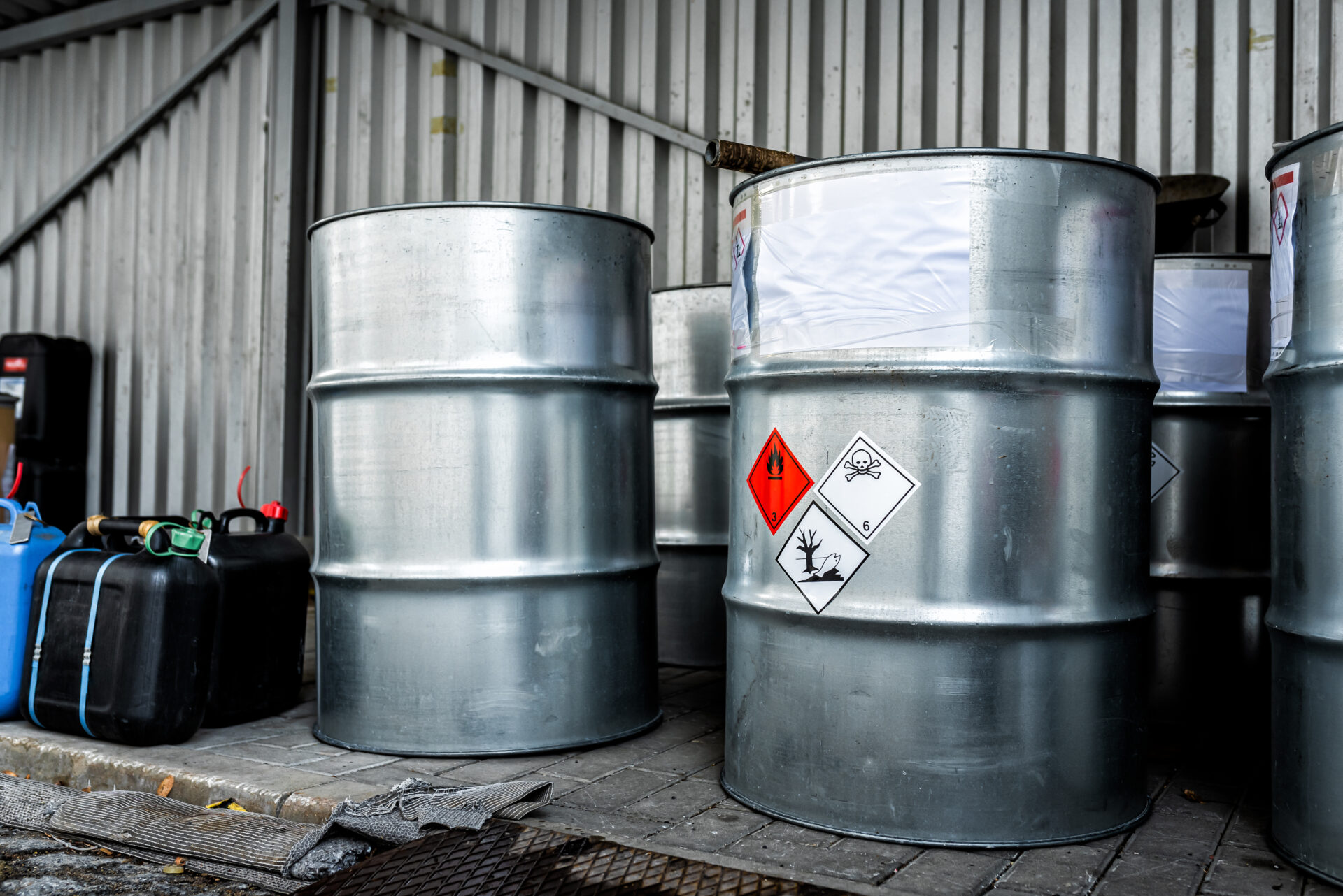 Big metal barrels containing hazardous chemicals from laboratories