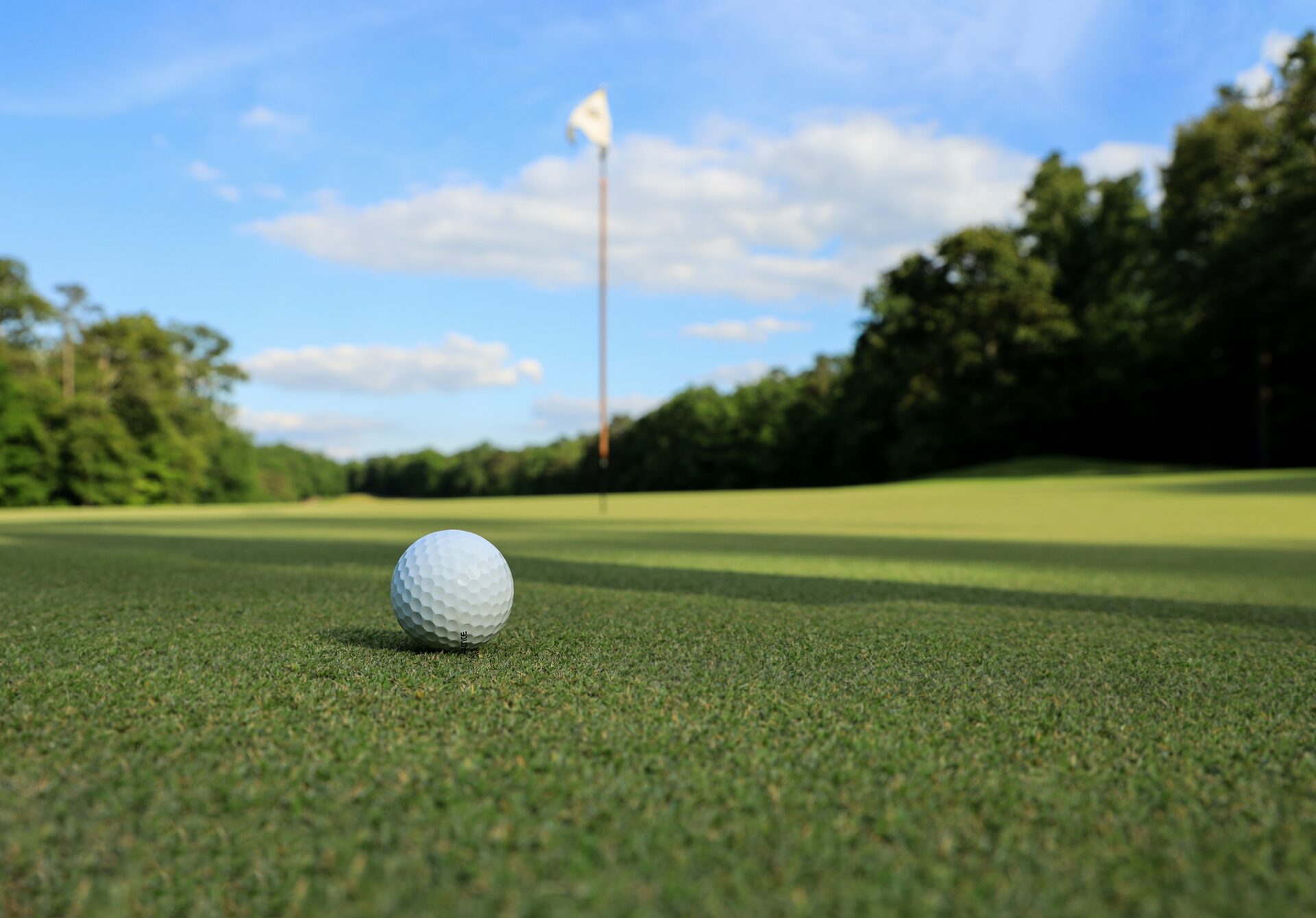 gold ball on green