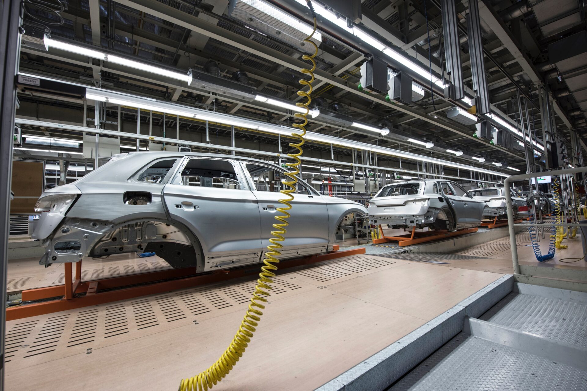 manufacturing cars in warehouse building a car